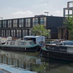 Narrowboats moored on the Regent's Canal opposite Containerville